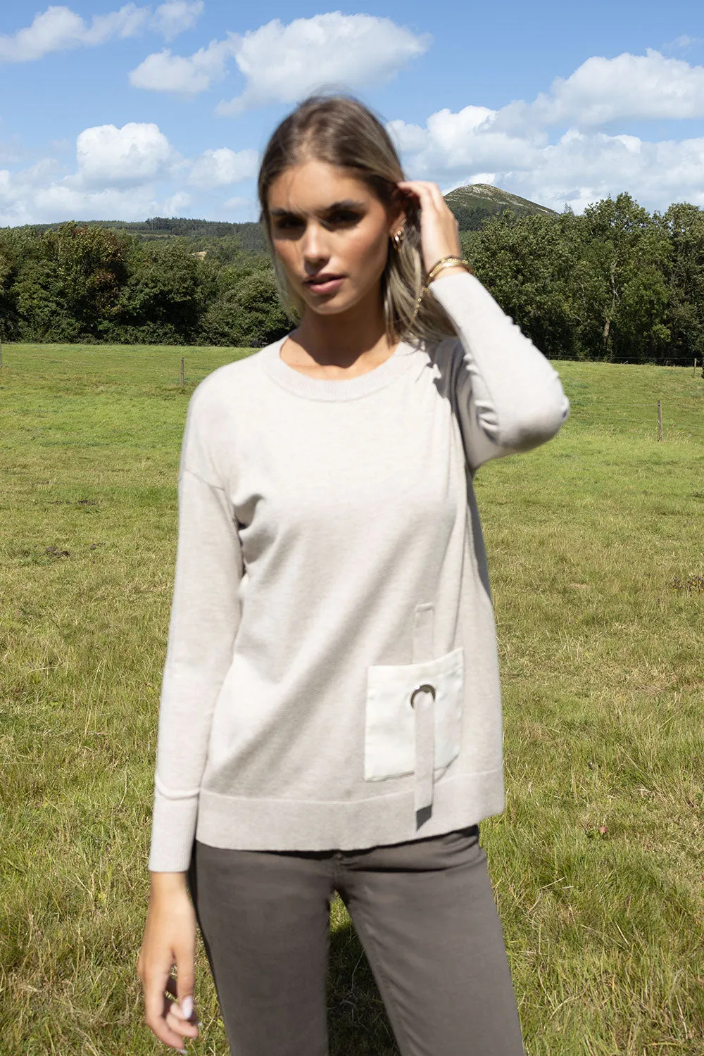 Genoa round neck long sleeve knit with pocket detail. Black or Beige