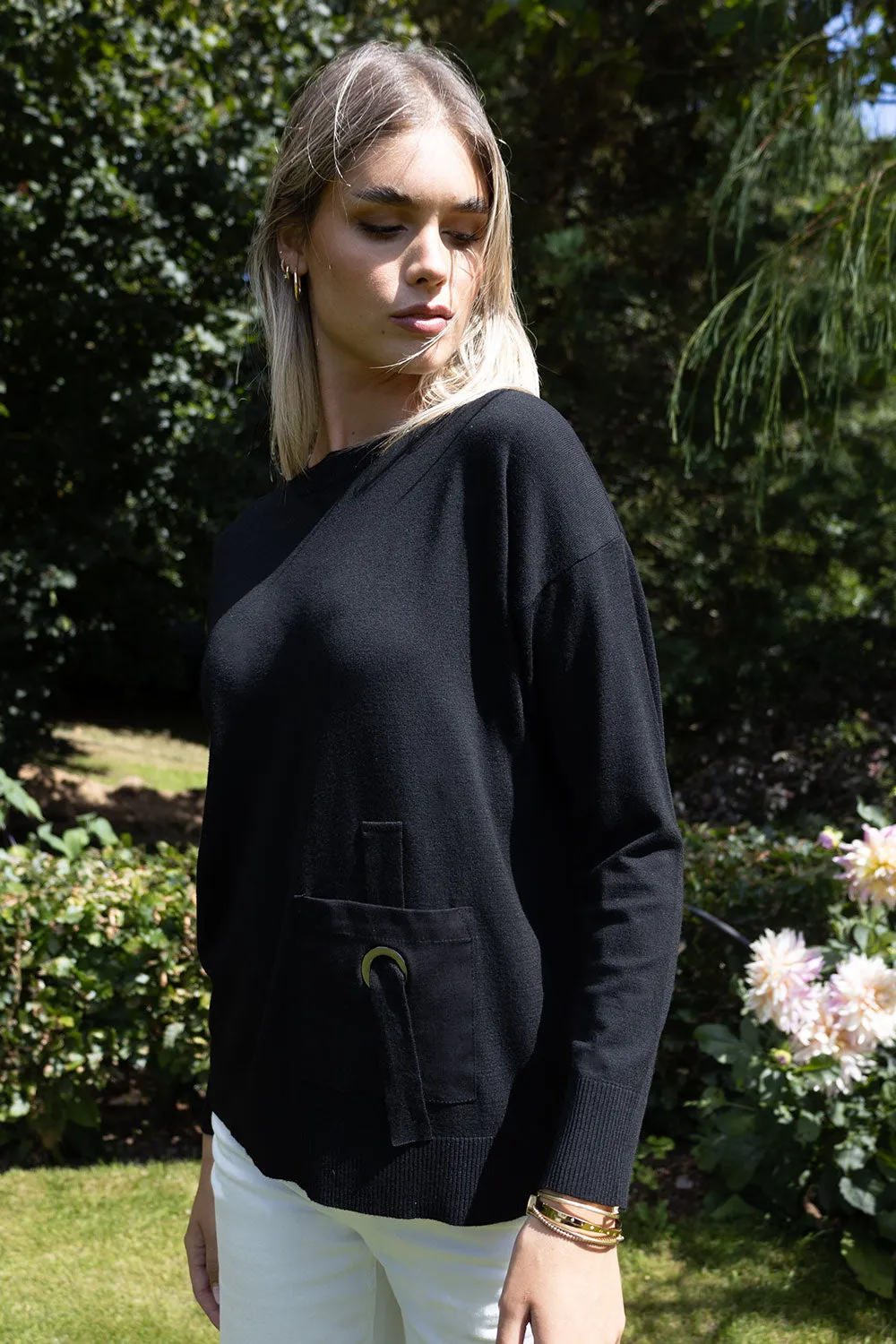 Genoa round neck long sleeve knit with pocket detail. Black or Beige